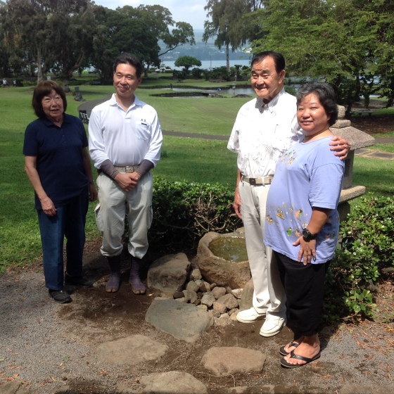 Clara Koga sensei, Takuhiro Yamada, Russ Oda and Amy Nishiura test the finished stone arrangement